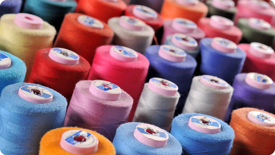 Colorful yarn on spool, yarn on tube, cotton, wool, linen thread 